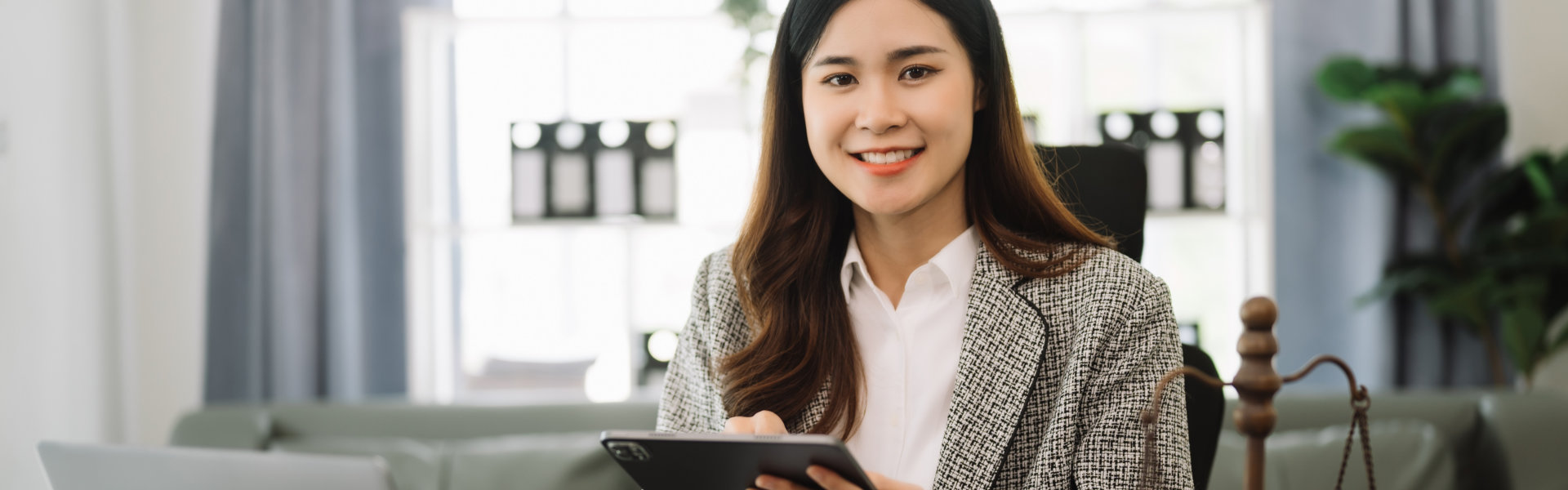 woman holding an ipad